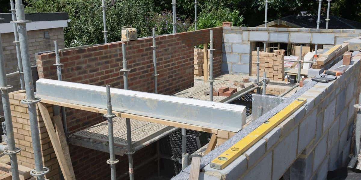 A house being built with bricks and concrete.